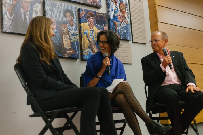 Two women and a man lead a talk.
