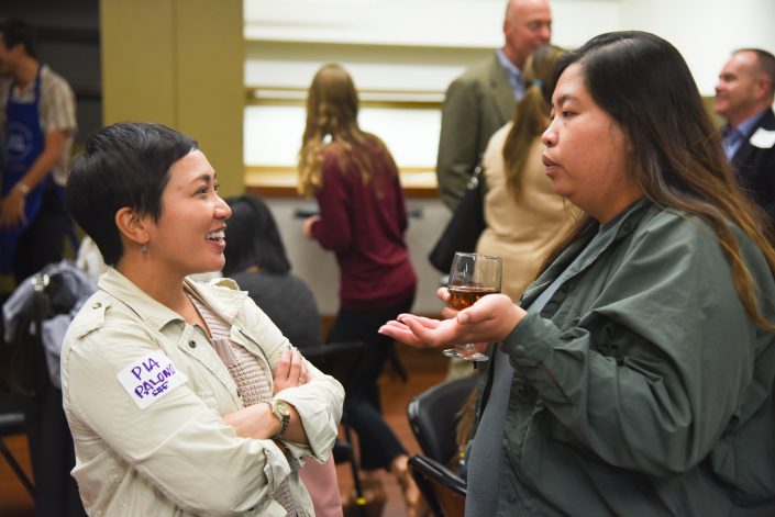 Two women talk to each other.